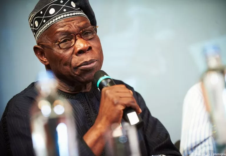 Olusegun Obasanjo-holding microphone